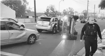  ??  ?? A self-driven Volvo SUV owned and operated by Uber Technologi­es Inc. is flipped on its side after a collision in Tempe, Arizona, US. — Reuters photo