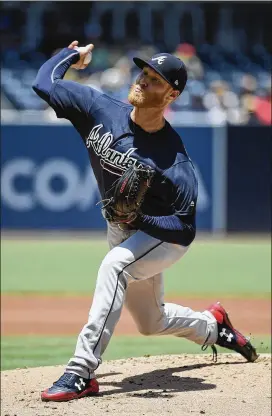  ?? DENIS POROY / GETTY IMAGES ?? Braves right-hander Mike Foltynewic­z gave up two runs on five hits in five innings against the Padres on Wednesday. He struck out eight and walked three.