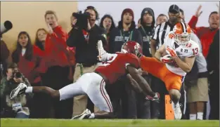  ?? The Associated Press ?? Clemson’s Hunter Renfrow, right, catches the winning touchdown pass behind Alabama’s Tony Brown during the second half of the NCAA championsh­ip game on Tuesday in Tampa, Fla.