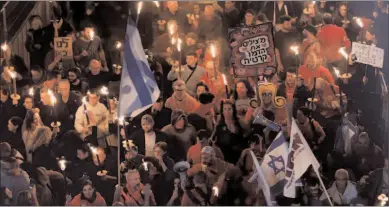  ?? -REUTERS ?? TEL AVIV
Israelis protest against Prime Minister Benjamin Netanyahu's new right-wing coalition and its proposed judicial reforms to reduce powers of the Supreme Court, in Tel Aviv, Israel.