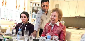  ??  ?? Princess Sheikha Latifa (left) looks on during a meeting with Mary Robinson in Dubai. — Reuters photo