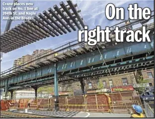  ??  ?? Crane places new track on No. 1 line at 204th St. and Nagle Ave. in the Bronx.