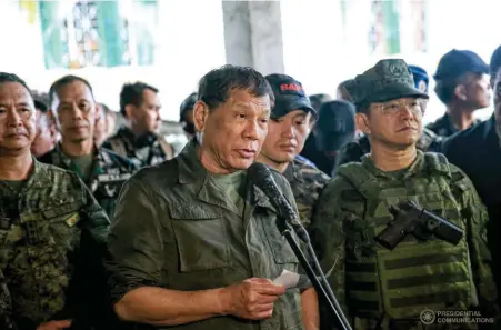  ?? (Photos by Albert Alcain) ?? President Rodrigo Roa Duterte visits the Tactical Command Post of the Joint Special Operations Task Force Trident in Barangay Kilala in Marawi City. During his recent visit, the President provided the soldiers in Marawi City with groceries and watches....