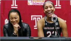  ?? CHRIS SZAGOLA — THE ASSOCIATED PRESS ?? South Carolina coach Dawn Staley, left, reacts as A’ja Wilson, right, answers a question about seeing a street named after Staley, following the team’s game against Temple Thursday. South Carolina won, 87-60.