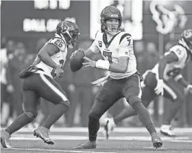  ?? ?? Houston Texans quarterbac­k C.J. Stroud steps back to pass against the New York Jets on Dec. 10 in East Rutherford, N.J. Stroud has passed for 3,631 yards and 20 touchdowns in his rookie season. ADAM HUNGER/AP