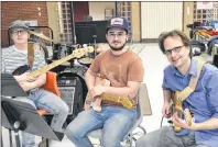  ?? SALLY COLE/THE GUARDIAN ?? Several pit band members for “High School Musical” take a break from practising. From left are Sam Langille, Josh Langille and Ian Toms. Missing from the photo is Mark Parsons, musical director for the show.