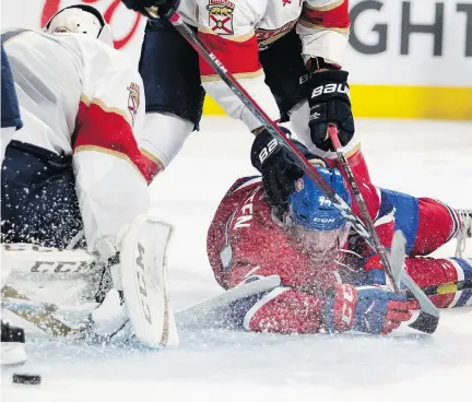  ?? ALLEN McINNIS ?? Canadiens forward Will Bitten keeps his eyes on the puck as he is pushed to the ice by Florida Panthers defenceman Keith Yandle Wednesday night. The Habs played a physical game and coach Claude Julien said he was happy to see that his team didn’t back down from any scuffles.