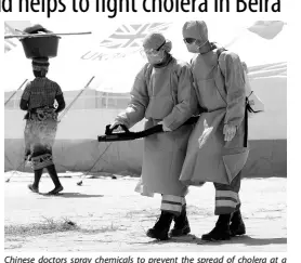  ?? AP ?? Chinese doctors spray chemicals to prevent the spread of cholera at a camp for displaced survivors of Cyclone Idai in Beira yesterday.