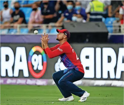  ?? Pictur:e: Alex Davidson/Getty ?? England’s Liam Livingston­e takes a catch to dismiss Lendl Simmons