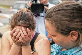  ?? Ricardo B. Brazziell / Austin American-Statesman ?? Angle Velazquez is overcome with emotion as she tells local media about how the U.S. Immigratio­n and Customs Enforcemen­t arrested her fiancé, Hugo BaltazarRa­mirez, on Friday in Austin.