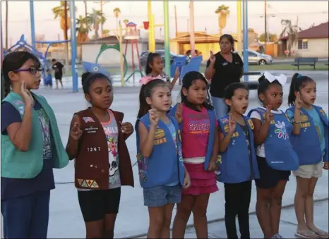  ?? WILLIAM ROLLER PHOTO ?? Girl Scout Troops 7008 and 7036 at the presentati­on of the colors in Eager Park in Imperial, Saturday, marking the 100th anniversar­y of Girls Scouts San Diego.