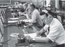  ?? ?? US Representa­tives Edward Boland (D-Mass., front) and Jack Edwards (R-Ala., second from the front) listen to Nixon’s White House tapes, compiled from some two dozen recording devices.