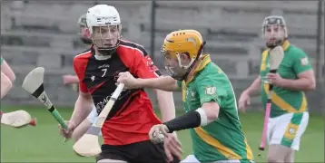  ??  ?? James Foley of Buffers Alley taking on Bannow-Ballymitty defender Conor Furlong.