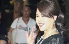  ??  ?? THAI Princess Ubolratana waves to people outside the Grand Palace in Bangkok.