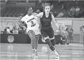  ?? ALONZO ADAMS/FOR THE OKLAHOMAN ?? Tuttle’s Allie Rehl dribbles the ball up the court against Harding Charter’s Monet Okine during a Class 4A girls basketball quarterfinal Wednesday at State Fair Arena.