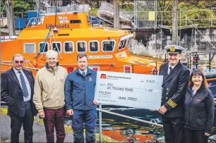  ??  ?? RNLI branch chairman Mike Robertson, treasurer Les Stewart, lifeboat mechanic Tom Kennedy, Captain Mark Scott and port manager Allison McDermott with the cheque.