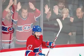  ?? DARIO AYALA/THE GAZETTE ?? Fans cheer after a goal by Alex Galchenyuk in 2013. New research suggests that viewing a hockey game can be a source of an intense emotional stress manifested by marked increases in heart rate.