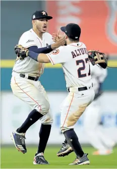  ?? RONALD MARTINEZ/GETTY IMAGES ?? Houston’s Jose Altuve and Carlos Correa are stars of baseball’s new generation of players and are likely to play a prominent role in the World Series.