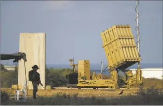  ?? AP file photo ?? A battery of Israel’s
Iron Dome defense missile system, deployed to intercept rockets, sits in Ashkelon, southern Israel, Aug. 7, 2022. An incoming attack by Iranian drones and ballistic missiles Sunday poses the latest challenge to Israel’s air defense system, which already has been working overtime to cope with incoming rocket, drone and missile attacks throughout the six-month war against Hamas.