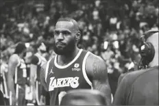  ?? CARLOS OSORIO/AP ?? LOS ANGELES LAKERS FORWARD LEBRON JAMES is ejected after fouling Detroit Pistons center Isaiah Stewart during the second half of a game on Sunday in Detroit.