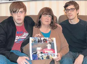  ??  ?? Pictured are Andrew, Elayne and Kyle Buchan with pictures of Jamie.