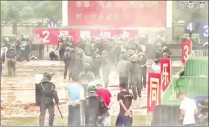  ?? CHINA’S PEOPLE’S LIBERATION ARMY (PLA) HONG KONG GARRISON/AFP ?? China’s military has released a slick propaganda video showing a drill of armed troops quelling a protest in Hong Kong, in a thinly veiled warning to the city’s pro-democracy movement.