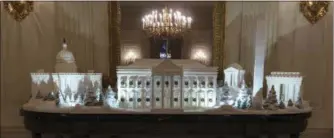  ?? CAROLYN KASTER — THE ASSOCIATED PRESS ?? The gingerbrea­d house, showcasing the full expanse of the National Mall: the Capitol, the Lincoln Memorial, the Jefferson Memorial, the Washington Monument, and, the White House is seen in the State Dining Room during the 2018 Christmas Press Preview at the White House in Washington, Monday.