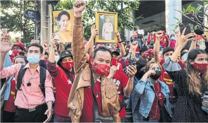  ?? LAUREN DECICCA GETTY IMAGES ?? Supporters of Myanmar’s de-facto leader, Aung San Suu Kyi, protest in Bangkok, Thailand following Monday’s military coup.