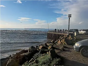  ?? STUFF ?? One man died and another was hospitalis­ed after their boat capsized trying to navigate the Kaituna Cut bar in dangerous conditions on Saturday.