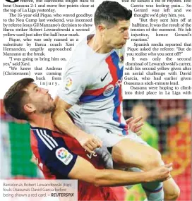  ?? – REUTERSPIX ?? Barcelona’s Robert Lewandowsk­i (top) fouls Osasuna’s David Garcia before being shown a red card.