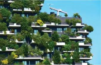  ?? ?? File photo shows apartment units with trees spilling over the balconies, at the Bosco Verticale (Vertical Forest) in Milan, Italy. — AFP photo