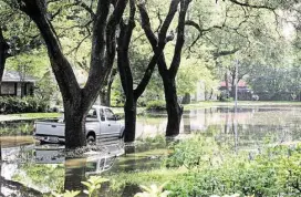  ?? Rick Campbell ?? When a street is swamped, as this one was Tuesday, going to work isn’t an option.