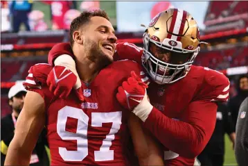  ?? JOSE CARLOS FAJARDO — BAY AREA NEWS GROUP ?? San Francisco 49ers' Nick Bosa (97) and San Francisco 49ers' Trent Williams (71) celebrate after defeating the New Orleans Saints during their NFL game at Levi's Stadium in Santa Clara on Nov. 27, 2022.