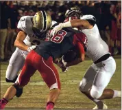  ?? TIM GODBEE / For the Calhoun Times ?? Sonoravill­e’s Tristan Key (18) is brought down by Calhoun’s Brannon Spector (3) and Bailey Lester.