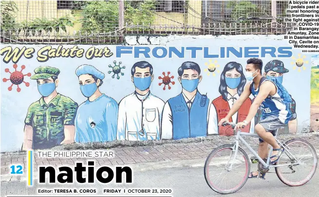  ?? EDD GUMBAN ?? A bicycle rider pedals past a mural honoring frontliner­s in the fight against COVID-19 in Barangay Amuntay, Zone III in Dasmariñas City, Cavite on Wednesday.