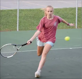  ?? Graham Thomas/Herald-Leader ?? Siloam Springs sophomore Eve Slater runs up to make a play during tennis practice Monday at the John Brown University Tennis Complex. The Lady Panthers open the season Aug. 16 at home against Alma.