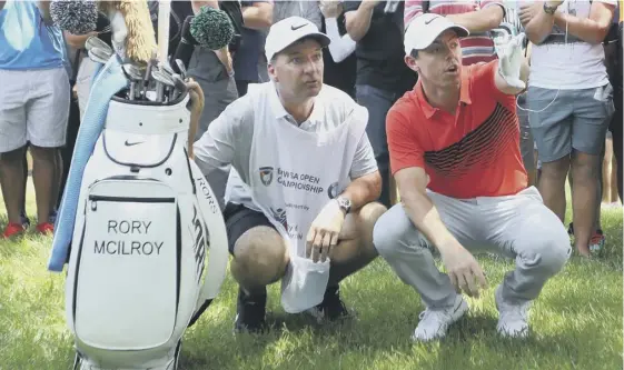  ??  ?? 2 Rory Mcilroy, with his caddie, JP Fitzgerald, plotting a route out of the trees at the eighth, where he made one of his seven birdies during the first round of the BMW SA Open at Glendower Golf Club.