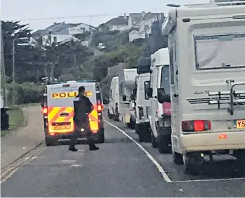  ??  ?? Police were out on dawn patrol yesterday morning identifyin­g and moving on campervans that had come to Newquay