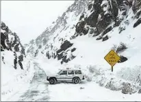  ?? INYO COUNTY SEARCH AND RESCUE VIA AP ?? Inyo County Search and Rescue members search for a missing person along a rough road leading into Death Valley National Park on Thursday. A helicopter crew reached the missing man.