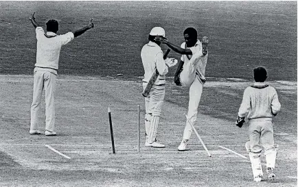  ?? PHOTO: OWEN JONES/SOUTHLAND TIMES ?? Michael Holding kicks out the stumps in the first test between New Zealand and the West Indies at Carisbrook in February, 1980.