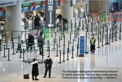  ??  ?? The Shanghai Hongqiao Internatio­nal Airport is nearly empty on the first day of the Spring Festival travel season yesterday. — Reuters