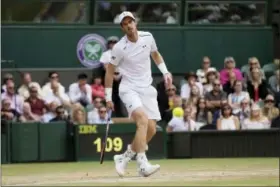  ?? TIM IRELAND — THE ASSOCIATED PRESS ?? Andy Murray watches as a shot from Sam Querrey passes by him during their men’s singles quarterfin­al match at Wimbledon on Wednesday.