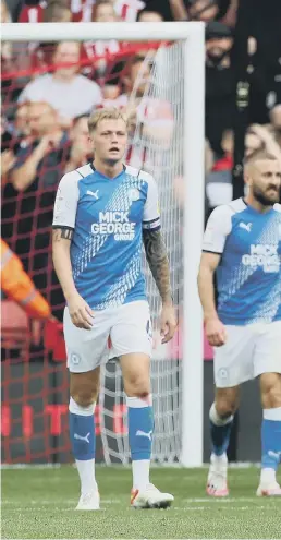  ??  ?? Posh dejected, Sheffield United ecstatic.