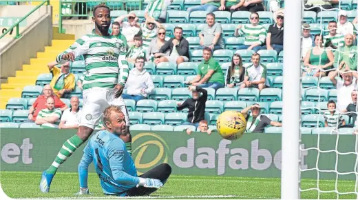  ??  ?? Moussa Dembele watches as his shot finds the net to put Celtic 2-0 ahead in the friendly against Standard Liege at Parkhead