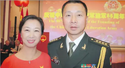  ?? ULLE BAUM PHOTOS ?? To mark the 88th anniversar­y of the founding of the Chinese People’s Liberation Army, military attaché Col. Haitao Zhu and his wife Yu Wang hosted a reception at the Chinese embassy.