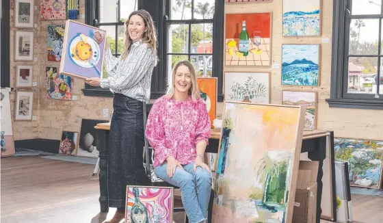  ?? Picture: Nev Madsen. ?? OPEN: The Toowoomba Gallery owners Bec Statton (left) and Niki Hall moved into their new lease at the Rowes complex.