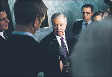  ?? AP/JACQUELYN MARTIN ?? Sen. Lindsey Graham (center), R-S.C., talks to reporters Thursday about the Deferred Action for Childhood Arrivals, or DACA, program, on Capitol Hill in Washington.