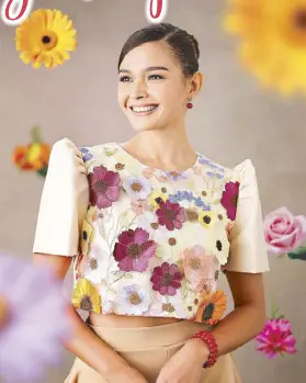  ?? ?? Event host and reigning Ms. Supranatio­nal Philippine­s Pauline Amelinckx dazzles in a cropped terno top with bright floral appliques that reflect her radiant personalit­y.