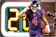  ?? AP PHOTO BY GARY LANDERS ?? Houston Texans quarterbac­k Deshaun Watson smiles after scoring a touchdown during the first half of an NFL football game against the Cincinnati Bengals, Thursday, in Cincinnati.