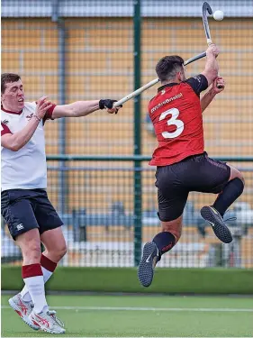  ?? Pictures: Peter Smith ?? Left: University of Bristol’s Ed Marshall is congratula­ted on scoring the first of his two goals in a 3-1 win against Oxford Hawks, which clinched the title for the students and promotion back into England Hockey Division One South. Above: A flying Robbie Jackson intercepts an overhead pass for University of Bristol